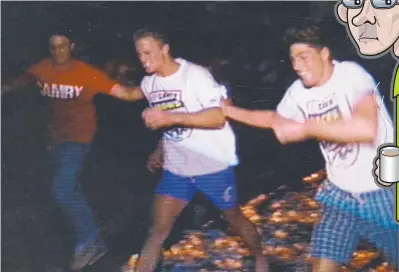  ??  ?? DON’T TRY THIS AT HOME: Anthony Ingerson (left) and Shaun Tasker (right) flank Nigel Smart as he walks barefoot on hot coals at Adelaide’s famous (definitely not iconic) pre-season training camp way back in 1992.
