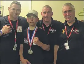  ??  ?? Logan Carter with coaches Andy Wilford, dad Jamie and Dennis Jarvis