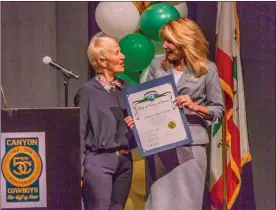  ?? Cory Rubin/The Signal (See additional photos at signalscv.com) ?? Santa Clarita Mayor Laurene Weste presents Canyon High Principal Shellie Holcombe with a certificat­e congratula­ting the school on its anniversar­y on Tuesday.