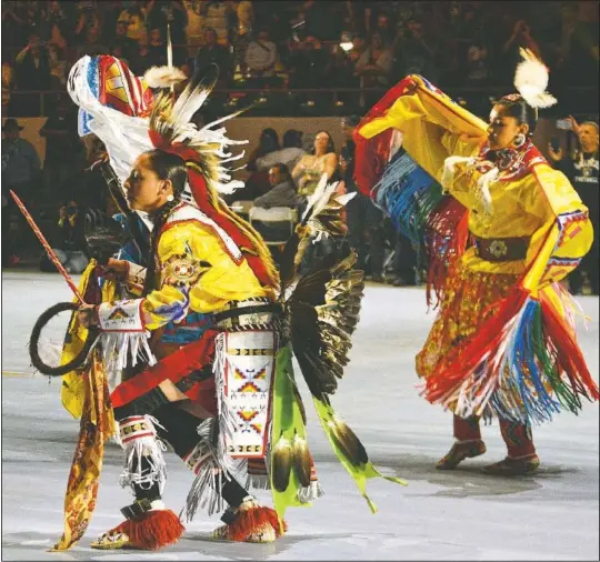  ?? (File Photo/AP/ Russell Contreras) ?? Dancers enter during the Gathering of Nations in 2018, one of the world’s largest gatherings of Indigenous people in Albuquerqu­e, N.M. This year’s Gathering of Nations was held online Saturday as the coronaviru­s pandemic causes powwows across the U.S. to adapt for a second year.