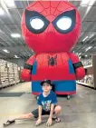  ?? John Wenzel, The Denver Post ?? Tom Wenzel makes his best Spider-Man landing pose in front of an oversized Funko Pop at Mile High Comics.