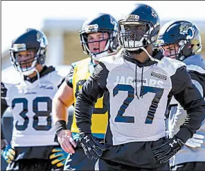  ?? AP/GARY MCCULLOUGH ?? Jacksonvil­le Jaguars running back Leonard Fournette (27) takes part in a drill during Thursday’s practice in Jacksonvil­le. Fournette said he is ready to go for Sunday’s game against the New England Patriots despite re-injuring his ankle and being in a fender-bender earlier this week.