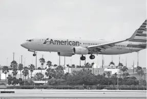  ?? WILFREDO LEE, ASSOCIATED PRESS ?? An American Airlines Boeing 737-823 lands at Miami Internatio­nal Airport in late July. American will add nonstop seasonal service between Milwaukee and Miami from November through April