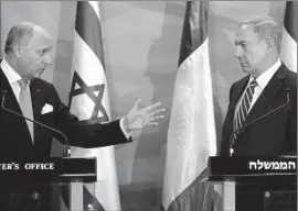  ?? Thomas Coex
Pool Photo ?? FRENCH Foreign Minister Laurent Fabius, left, and Israeli Prime Minister Benjamin Netanyahu in Jerusalem. Israel rejects the idea of France’s resolution.