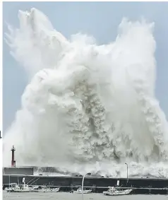  ?? — Reuters photo ?? High waves triggered by Typhoon Jebi are seen at a fishing port in Aki, Kochi Prefecture, western Japan, in this photo taken by Kyodo.