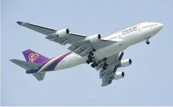  ??  ?? A Thai Airways Boeing 747 plane prepares to land at Changi Internatio­nal Airport in this file photo.