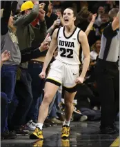  ?? MATTHEW HOLST — GETTY IMAGES/TNS ?? Iowa’s Caitlin Clark celebrates after breaking the NCAA women’s all-time scoring record on Thursday night.