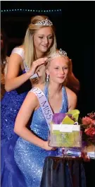  ?? PILOT PHOTO/JAMES MASTER ?? Jaela Marie Faulkner is shown being crowned as the 2021 Miss Blueberry Queen by the 2019 Miss Blueberry Queen Abigail Powell.