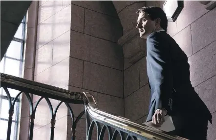  ?? — THE CANADIAN PRESS ?? Prime Minister Justin Trudeau heads to his office after apologizin­g for taking a vacation to the Aga Khan’s private island, in contravent­ion of conflict of interest guidelines.