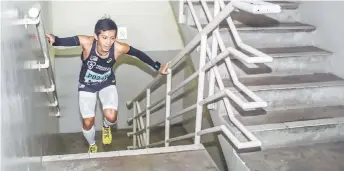  ?? — Bernama photo ?? File photo shows Wai Ching competes in a tower run competitio­n.