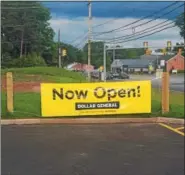  ?? DONNA ROVINS — DIGITAL FIRST MEDIA ?? A sign along Route 422 in Amity, Berks County, announces the opening of the newest Dollar General location at 103 N. Monocacy Creek Road.