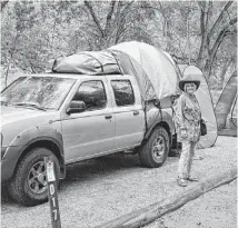  ?? MIMI MILLIKEN ?? Mimi Milliken and her husband were looking for a change, so they decided to try camping. They soon discovered the truck tent.