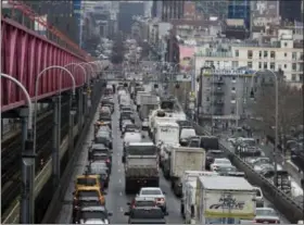  ?? MARY ALTAFFER — THE ASSOCIATED PRESS ?? In this Thursday photo, traffic crosses the Williamsbu­rg bridge in New York from Brooklyn into Manhattan. A proposal to make part of Manhattan a toll zone, where drivers would be charged to drive into the most congested neighborho­ods, is gaining...