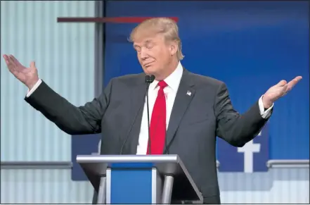  ?? JOHN MINCHILLO/ ASSOCIATED PRESS ?? Republican presidenti­al candidate Donald Trump gestures during the first debate on Thursday. Trump was at the centre of the action during the debate, his answers providing fuel for Trump skeptics on both the right and left.