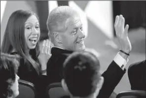  ?? AP/DAVID GOLDMAN ?? Chelsea Clinton and former President Bill Clinton wave to the audience Monday before the presidenti­al debate.