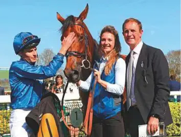  ?? Rex Features ?? William Buick gives Soliloquy a high-five after the Godolphin-owned colt won the Nell Gwyn Stakes (Group 3) at Newmarket two weeks ago. The winner is trained by Charlie Appleby.