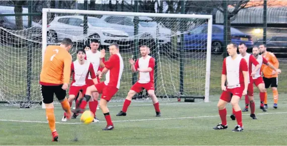  ??  ?? Crowded out
Sean Wilbert’s shot is blocked by a packed Holytown Colts defence