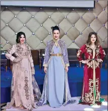  ?? ?? Fashion designer Hayat Karimi of Royal Style, Marrakech, curated a fashion show exclusivel­y for the Internatio­nal Women’s Group Kuwait on the occasion of Internatio­nal Women’s Day. Here she poses at the end of the show flanked by her two models.