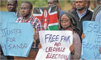  ?? BEN CURTIS, AP ?? Kenyans at a demonstrat­ion last week in Nairobi protest the killing of electoral commission informatio­n technology manager Christophe­r Msando ahead of Tuesday’s vote.