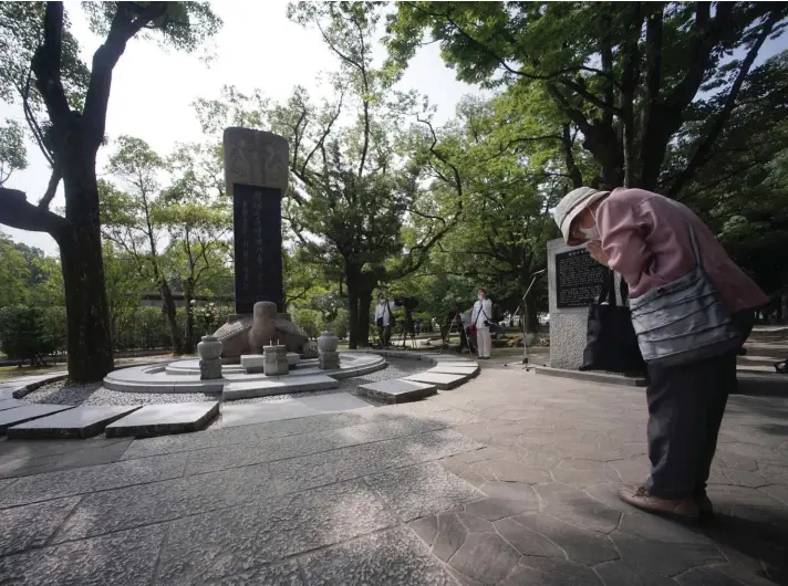  ??  ?? A woman prays before a memorial service for Korean atomic bomb victims in front of Monument to Korean Victims and Survivors at Hiroshima Peace Memorial Park in Hiroshima, western Japan, yesterday. Hiroshima marks the 75th anniversar­y of the world's first atomic bombing yesterday. Photo: AP