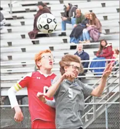  ?? Scott Herpst ?? Saddle Ridge’s Elijah Decker collides with Rossville’s Dyllan Lecroy after both players try to get their heads on a free ball during Thursday’s match at Ridgeland.