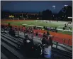  ?? ANDA CHU — BAY AREA NEWS GROUP ?? A limited number of fans watch as San Mateo and Capuchino varsity football teams warm up before the start of a season-opening high school football game in San Mateo on Friday, March 12.