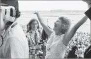  ?? JACK KANTHAL — THE ASSOCIATED PRESS FILE ?? This file photo shows Penny Chenery, owner of Secretaria­t, reacting after her horse won the Belmont Stakes, and the Triple Crown, at Belmont Park in Elmont, N. Y. Chenery, who bred and raced 1973Triple Crown winner Secretaria­t as well as realizing her disabled father's dream to win the Kentucky Derby in 1972with Riva Ridge, died Saturday at her Boulder, Colo. home following complicati­ons from a stroke, her children announced Sunday through Leonard Lusky, her longtime friend and business partner. She was 95.