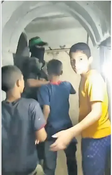  ?? ?? The video purports to show Palestinia­n boys in one of the tunnels. Israel claims the children deliver messages and ammunition