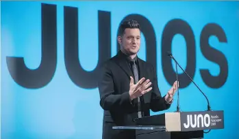  ?? THE CANADIAN PRESS ?? Michael Buble speaks after being introduced as the host of the 2018 Juno Awards, which will be held in Vancouver. He was to host last year, but stepped aside following his son Noah’s cancer diagnosis.