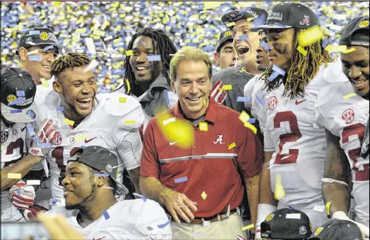  ?? HYOSUB SHIN / HSHIN@AJC.COM ?? Coach Nick Saban, celebratin­g with his team, is 9-1 with Alabama in the Georgia Dome, including 5-1 in SEC Championsh­ip games. The Crimson Tide built a 33-9 second-quarter lead in Saturday’s game and cruised to victory.