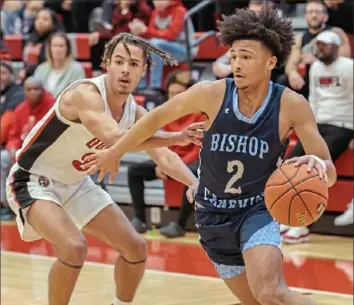  ?? JJ LaBella/For the Post-Gazette ?? Bishop Canevin’s Shea Champine, right, drives past Aliquippa’s D.J. Walker Saturday in a Class 2A quarterfin­al at Peters Township.