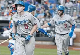  ?? Julie Jacobson Associated Press ?? COREY SEAGER (5) HEADS for the dugout after his long two-run home run in the ninth inning gave the Dodgers a 7-3 lead over the Mets. He has 19 homers.