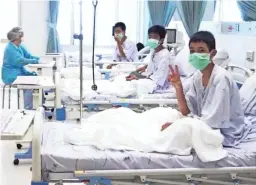  ??  ?? The first images of the rescued boys emerged Wednesday from the hospital in Chiang Rai province, Thailand.