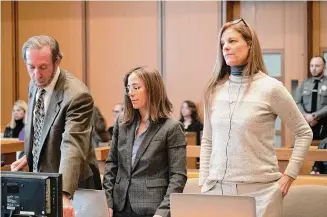  ?? ?? Michelle Troconis, right, stands in Stamford Superior Court with her attorneys, Jon Schoenhorn and Audrey Felsen on Friday.