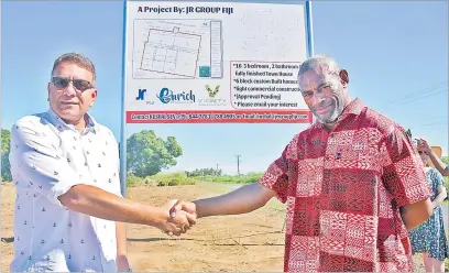  ?? Picture: REINAL CHAND ?? JR Group Fiji director Jason Raj (left) with landowner Ponipate Bainivalu unveil the land developmen­t project at Lavusa in Nadi.