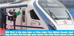  ??  ?? NEW DELHI: In this photo taken on Friday, Indian Prime Minister Narendra Modi flags off India’s first semi-high speed express train Vande Bharat Express at New Delhi Railway Station. — AFP