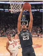  ?? BRAD PENNER / USA TODAY SPORTS ?? Penn State’s Josh Reaves dunks for the winning basket against Ohio State.