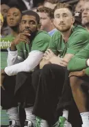  ?? STAFF PHOTO BY NICOLAUS CZARNECKI ?? SITTING IT OUT: Kyrie Irving and Gordon Hayward watch last night’s game against the Sixers from the bench.