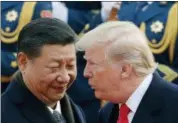  ?? ANDY WONG — THE ASSOCIATED PRESS FILE ?? President Donald Trump, right, chats with Chinese President Xi Jinping during a welcome ceremony at the Great Hall of the People in Beijing.