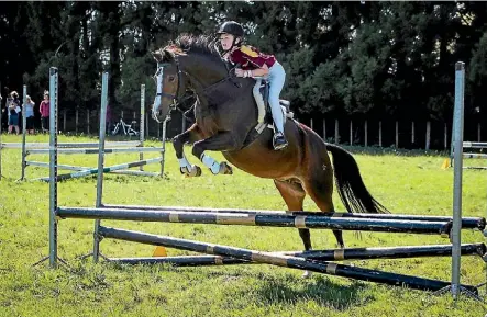  ?? EMMA JAMES ?? Alisha Macfarlane at the Waikato Interschoo­l Show Jumping Championsh­ips.