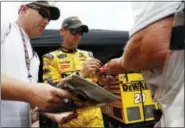  ?? WADE PAYNE — THE ASSOCIATED PRESS ?? Driver Matt Kenseth signs autographs for fans after practice for the NASCAR Monster Energy Cup Series auto race Friday in Bristol, Tenn.