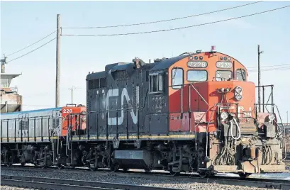  ?? GRAHAM HUGHES/THE CANADIAN PRESS FILE PHOTO ?? CN Rail has apologized for failing to keep grain shipments moving reliably by rail, and said it’s mobilizing more train cars.