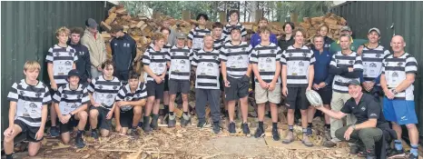  ??  ?? Students, coaches and whānau delivering firewood. PHOTO: Supplied.