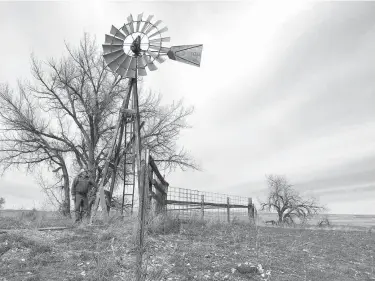  ?? Associated Press ?? n Rancher L.J. Turner stands near a water well March 29 that he says has run dry on his spread south of Gillette, Wyo., because of coal mining and coal-bed methane drilling in the area. Many locals say after 500 coal-mine layoffs and the industry's...
