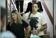  ?? ALEXANDER ZEMLIANICH­ENKO — THE ASSOCIATED PRESS ?? WNBA star and two-time Olympic gold medalist Brittney Griner is escorted to a courtroom for a hearing, in Khimki just outside Moscow, Russia, on July 1.