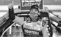  ?? GERRY BROOME/AP ?? Chase Elliott celebrates after winning the NASCAR Truck Series auto race at Charlotte Motor Speedway Tuesday in Concord, N.C.