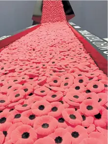  ?? GALEN EAGLE/SPECIAL TO THE EXAMINER ?? A temporary exhibit at the Juno Beach Centre in Normandy. Each poppy represents a Canadian soldier who was killed in France.