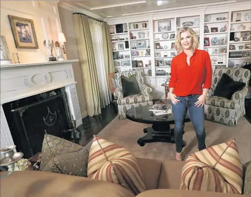  ?? Mel Melcon Los Angeles Times ?? “I LOVE ALL the wood in it and the bookshelve­s,” Alison Sweeney says of the family’s social space. “And ... the drop-down screen.”