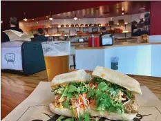  ??  ?? LARDO: The restaurant scene in Portland buzzes with hot sipping and noshing options including Lardo, where a banh mi is perfect paired with beer.