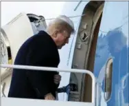  ?? THE ASSOCIATED PRESS ?? President Donald Trump boards Air Force One on Friday in Andrews Air Force Base, Md., en route to Palm Beach Internatio­nal Airport, in West Palm Beach, Fla.